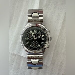 The watch in the image is a Swatch Irony Chrono Cadmos, model # YCS409G